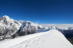 Skiers in deep snow, Austria, ski tours, freeride, South Tyrol, wintry mountains