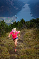 Mountain runner on the way to the Bärenkopf high above the Achensee, Tyrol, Austria