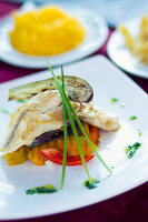 Fish and some vegetables on a plate in Havana, Cuba