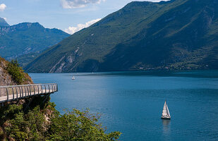 The Limone sul Garda cycle path suspended over Lake Garda gives a breathtaking spectacle to tourists. Brescia, Lombardy. Italy