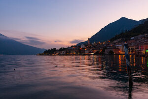 Limone sul Garda illuminated by the lights of the sunset. .