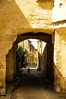 Small stone tunnel in the medieval city of Arles, France.