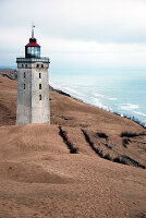 The famous Rubjerg Knude lighthouse, built in 1899, closed to visitors due to quicksand and cliff erosion. located in Lokken, Denmark