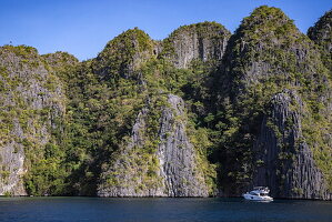  Motorboat and karst rock island, Coron, Palawan, Philippines 
