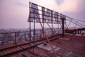 Neon sign of Sarina Hotel on the roof seen from behind overlooking the city, Dhaka, Dhaka, Bangladesh, Asia 