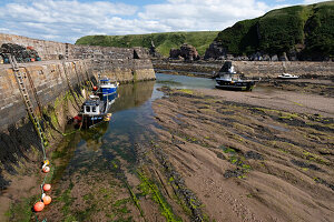  View of an old harbour at low tide, East Lothian, Scotland, United Kingdom 