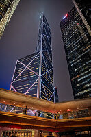 Exterior view of skyscrapers in Central District illuminated at night. Hong Kong, China.