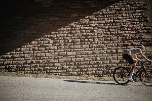 Road biking, woman riding a racing bike on the road