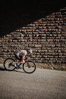 Road biking, woman riding a racing bike on the road