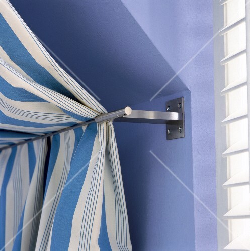 Interior Of Dormer Window With White And Blue Striped Curtains