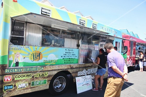 People At A Food Truck Festival In License Images