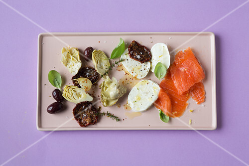 Antipasti platter with smoked salmon and mozzarella (keto cuisine)