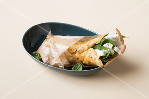 A ham wrap with gorgonzola and spinach (keto cuisine)