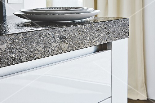 A Granite Worktop Over White Kitchen Drawers Buy Images