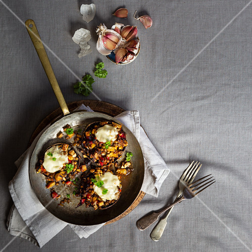 Stuffed Mushrooms with garlic lentils red pepper and tofu topped with mozerella cheese and parsley