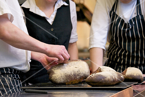 Waiter have a look at fresh baked bread
